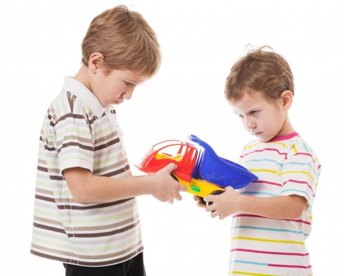 two-boys-fighting-over-toy-truck